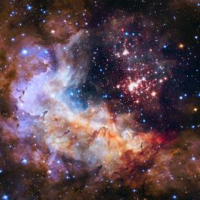 This cluster of about 3,000 stars in our Milky Way is called Westerlund 2 and contains some of the galaxy's hottest, brightest, and most massive stars. © NASA, ESA, Antonella Nota (ESA, STScI), Hubble Heritage Project (STScI, AURA), Westerlund 2 Science Team