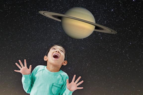 Boy with Planet Saturn