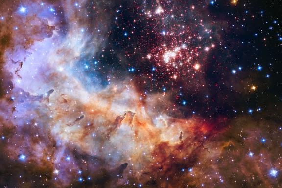 This cluster of about 3,000 stars in our Milky Way is called Westerlund 2 and contains some of the galaxy's hottest, brightest, and most massive stars. © NASA, ESA, Antonella Nota (ESA, STScI), Hubble Heritage Project (STScI, AURA), Westerlund 2 Science Team 
